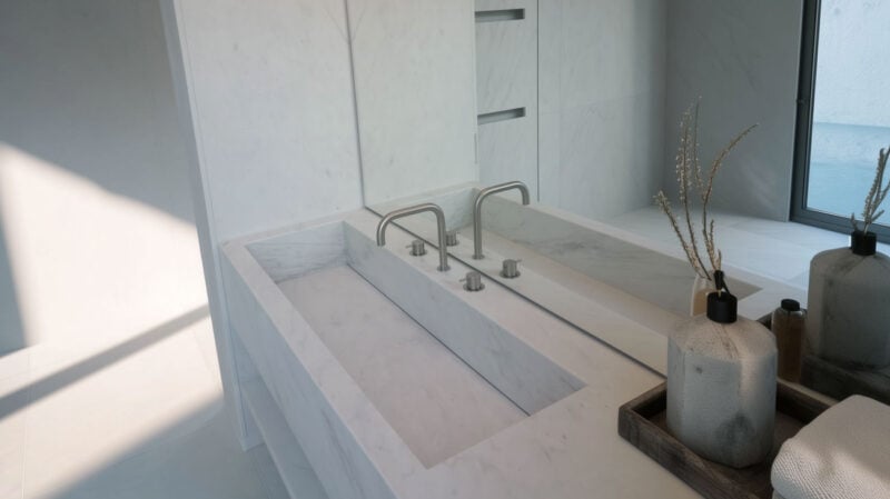 lavandino in marmo bianco integrato con rivestimento