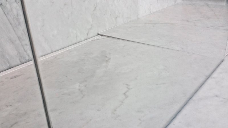 modern shower base in Carrara marble