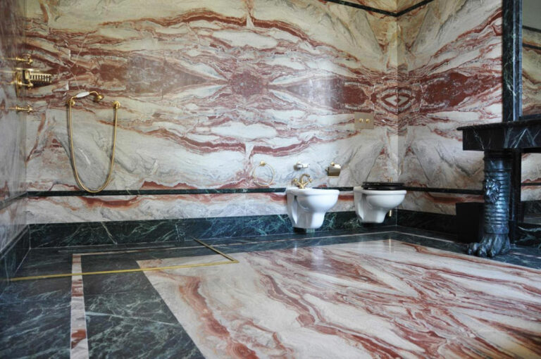 Bathroom with floor and wall covering in marble