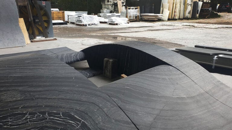 black modern veined marble fireplace