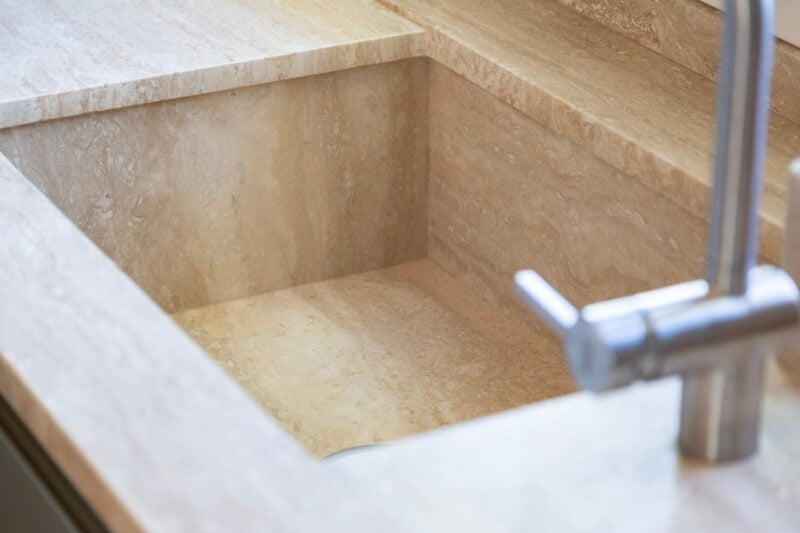 travertine kitchen countertop with integrated sink
